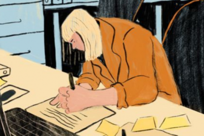 A woman hunched over her desk, handwriting a note. On the desk is a laptop, pens and paper. Art by Haley Tippmann.