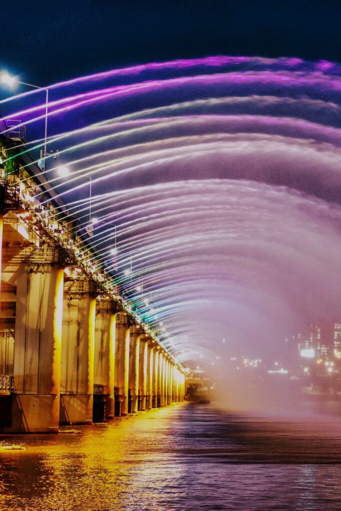 Banpo River lights and fountains in Seoul, South Korea. 380 rainbow-coloured jets from both sides of Banpo bridge are sprayed over the Han River. It's a must-see in Seoul.