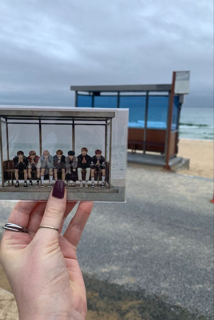 Hyangho Beach bus stop is one for the Gangwon-do bucket list. This iconic bustop is known as the BTS bus stop. Behind the bus stop is the Ocean. In front of the bus stop, Storm on the Horizon is holding the image that made it famous: a photo of the BTS members.