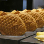 Upside down Bungeoppang (붕어빵) waiting to cool. These are fish-shaped pastries resembling carp, based off a Japanese snack. Shared by Storm on the Horizon in a guide to vegetarian street food in South Korea