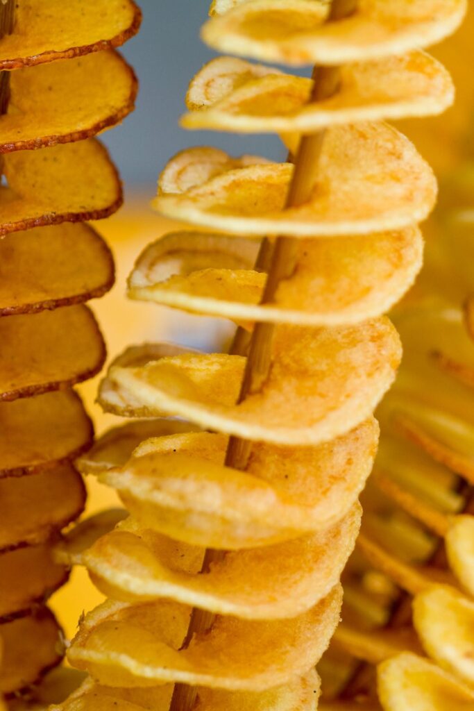 Tornado potato close up photo: A fried potato snack you can eat off a stick.Shared on StormOnTheHorizon - a travel site for South Korea, Europe and the UK